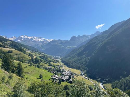 a valley in the swiss alps with mountains at Chalet Alma in Champoluc