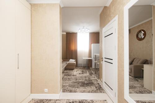 a hallway leading to a room with a living room at Aparthotel Royal Status in Chişinău