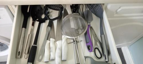 a drawer filled with lots of kitchen utensils at Contractor Lodge- 6 Bedrooms-Sleeps 10-Free Parking- Weekly Stays in Hull