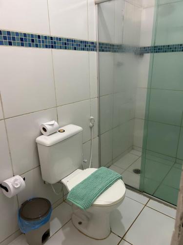 a bathroom with a toilet and a glass shower at Pousada do Trinta in Fernando de Noronha