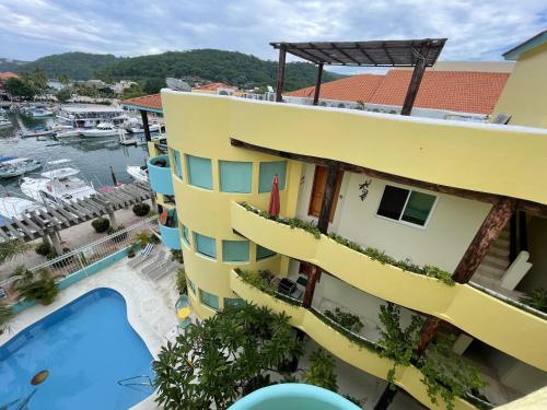 an aerial view of the hotel and the marina at Real Marina Blue 102B - Santa Cruz in Santa Cruz Huatulco