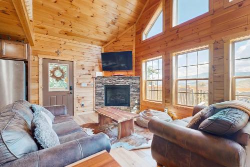 a living room with a couch and a fireplace at 4428 Stackstone Rd, Sevierville, TN 37862 in Park Settlement