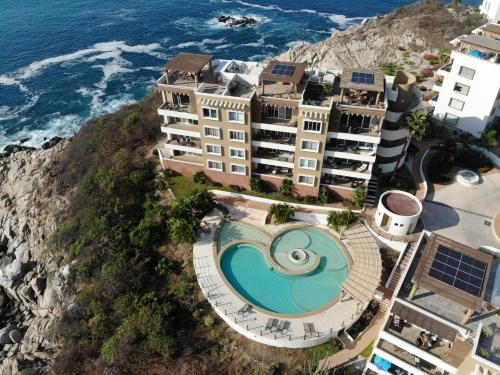 an aerial view of the hotel and the ocean at Oceanview Punta Arrocito Luxury Condo, Near Arrocito Beach in Santa Maria Huatulco