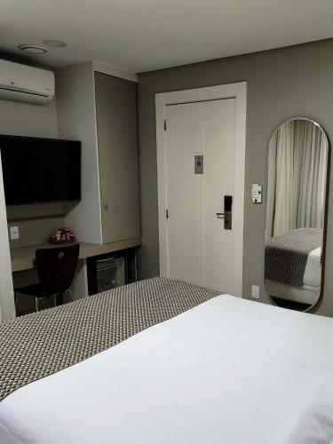 Ένα ή περισσότερα κρεβάτια σε δωμάτιο στο Hotel San Pietro