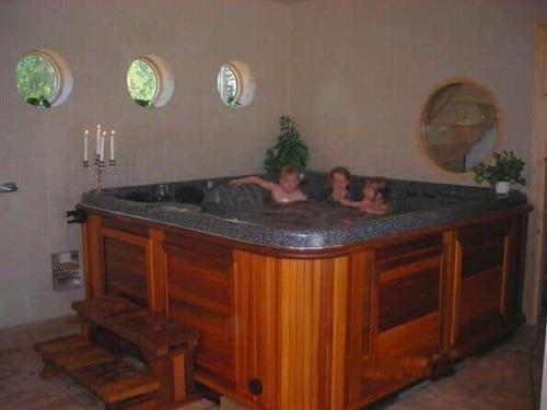 two girls are in a tub in a bathroom at SKA713-Bjaernum-PL-3290 in Bjärnum
