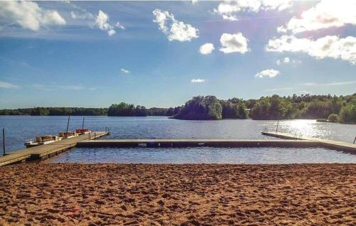 a dock on a lake with boats on it at SKA580-Perstorp-Oerahult-708 in Örahult