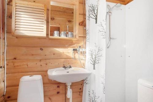 a bathroom with a white sink and a toilet at JON398-Joenkoeping-Hyltena-15 in Lovsjö