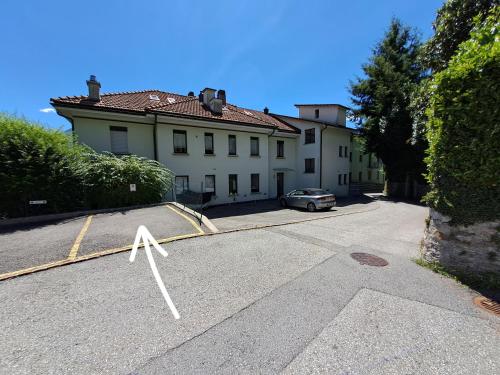 a house with a cross in the middle of a street at Romantic Lake View Apartment with Balcony and Parking in Orselina Locarno in Orselina