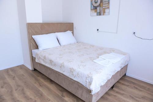 Postel nebo postele na pokoji v ubytování Stan na dan-Studio 10 centar Gradiška