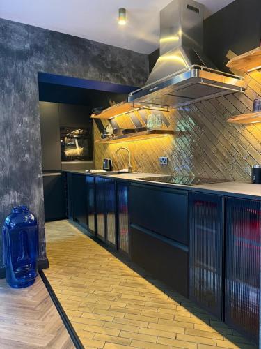 a kitchen with a sink and a counter top at The Funky Hideaway with hot tub in Bangor