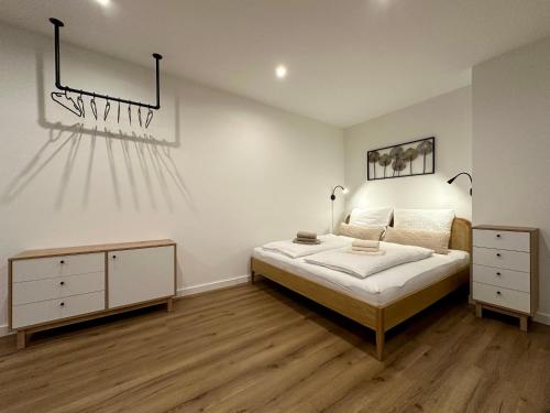 En eller flere senge i et værelse på Ferienwohnung an der Roseninsel