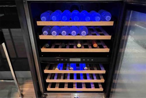 a refrigerator filled with lots of bottles of wine at Villa Modere' in Tortola Island
