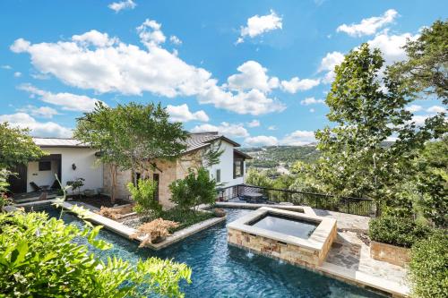 an exterior view of a house with a swimming pool at Hacienda - A Birdy Vacation Rental in San Antonio