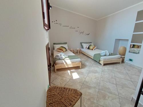 a living room with two beds and a couch at Polizzihouse in Polizzi Generosa