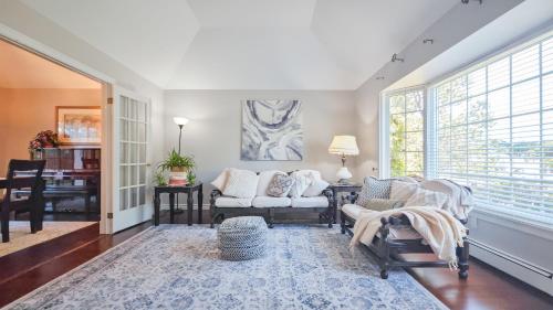 a living room with two chairs and a couch at Diana House in Charlottetown