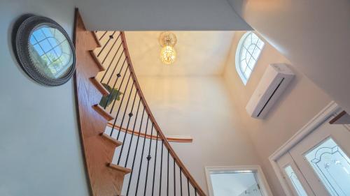 a staircase in a home with a clock on the wall at Diana House in Charlottetown