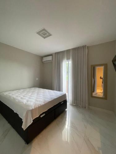 En eller flere senge i et værelse på Casa de Campo vila velha Israel Retiro do Congo