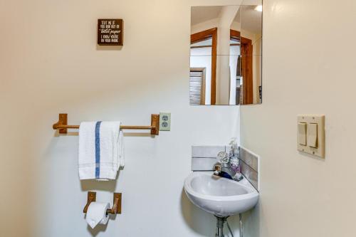 a white bathroom with a sink and a mirror at Ski, Hike and Fish Mtn-View Maggie Valley Retreat in Maggie Valley