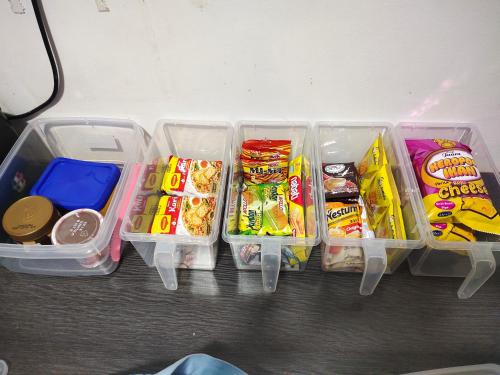 a refrigerator filled with different types of food and snacks at Homestay Alor Setar - VILLA FARAH in Alor Setar