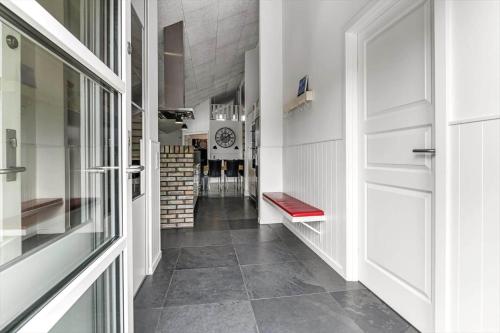 a hallway with a door and a dining room at HS006-Henne-Musvagevej-18 in Henne Strand