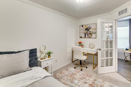 a bedroom with a bed and a desk with a chair at Modern Comforts and Fenced Yard Princeton Retreat! in Princeton