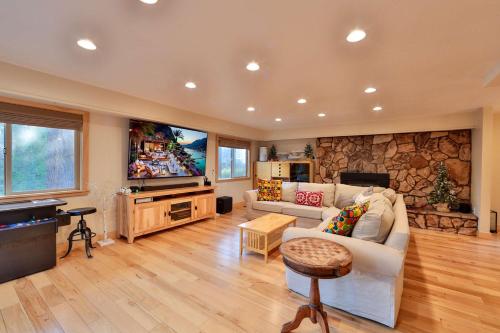 a living room with a white couch and a television at The Meadows - Ski Lease - Extended 30 Plus Days in South Lake Tahoe