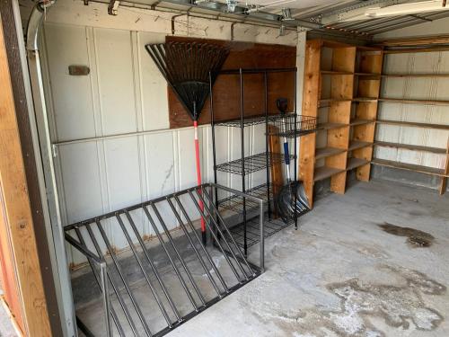a room with a cage in the corner of a room at Mulberry House in Fruita