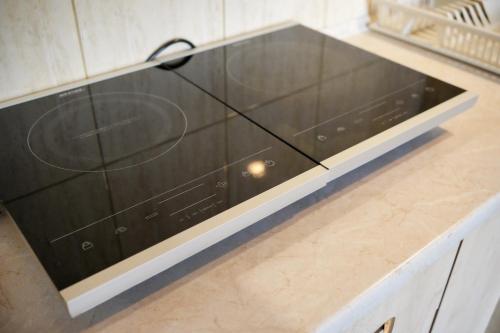 a large glass cabinet in a kitchen at POKOJE GOŚCINNE IRGA in Starogard Gdański