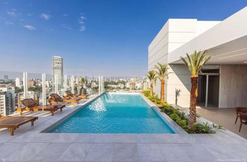 a swimming pool on the roof of a building at Apartment in Equipetrol in Santa Cruz de la Sierra