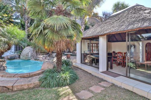 a house with a swimming pool in the yard at The Link Accommodation in Kempton Park