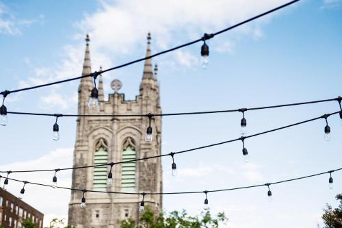 a church steeple with christmas lights in front at C3- Hotel Art De Vivre in Quebec City