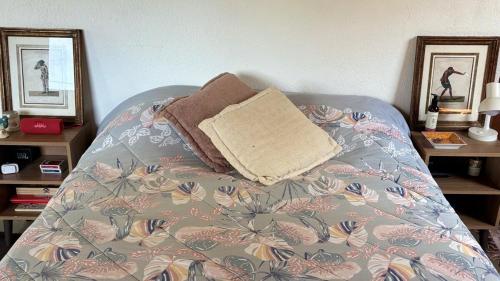 a bed with a pillow on top of it at Quinta São Xico Cabin - São Francisco Xavier in São Francisco Xavier