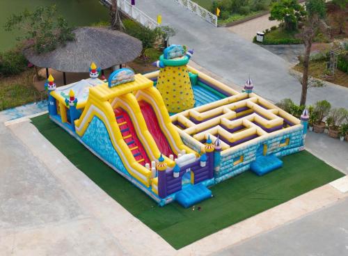 a inflatable water park with a water slide at Moc Chau Island - Bach Long Glass Bridge in Mộc Châu