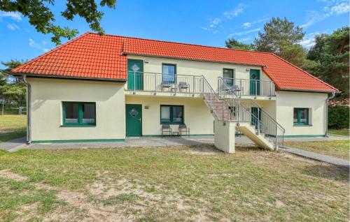 a house with an orange roof and a staircase at Nice Apartment In Altenkirchen in Altenkirchen
