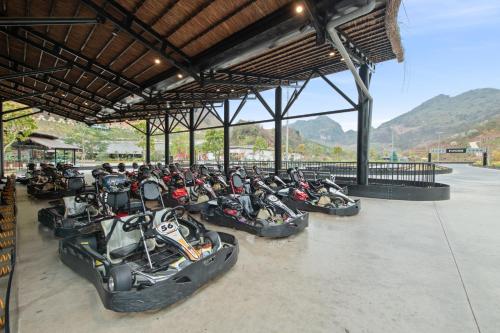 a row of motorcycles parked in a building at Moc Chau Island - Bach Long Glass Bridge in Mộc Châu