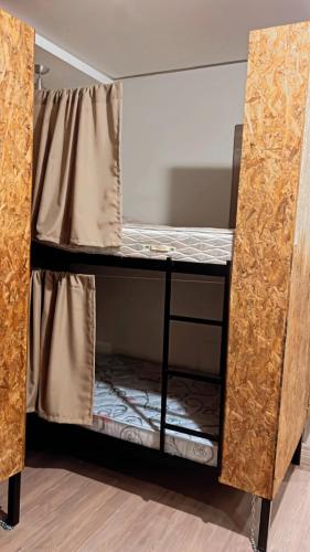 a bunk bed in a room with ajarhaarhaarhaarython at STOP Mar Suite Privada - NI in Nova Iguaçu