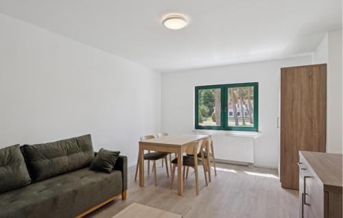a living room with a couch and a table at Amazing Apartment In Altenkirchen With Wifi in Altenkirchen