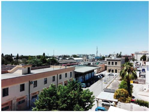 an overhead view of a city with buildings and trees at Corte del Pascià in Lecce