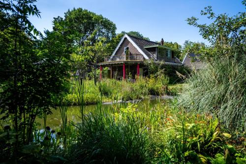 a house in the middle of a pond at Reijgershof - The Barok lounge in Amsterdam