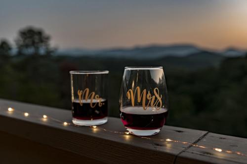 two glasses of wine sitting on top of a table at The Glass Chalet in Williamsburg
