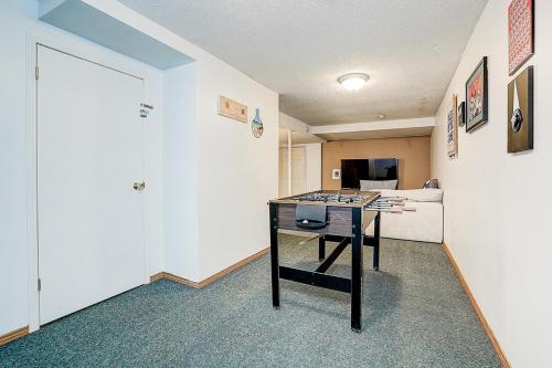 a room with a table in the middle of a room at Charming Autumn Getaway Sleeps 6 Mins to Lake in Barrie