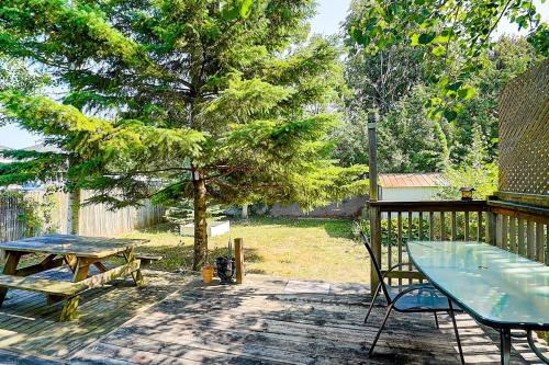 a patio with a table and a picnic table at Charming Autumn Getaway Sleeps 6 Mins to Lake in Barrie