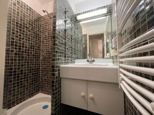 a bathroom with a sink and a mirror at Studio 4 personnes avec balcon, proche pistes, animaux acceptés - FR-1-572-312 in Les Carroz d'Araches