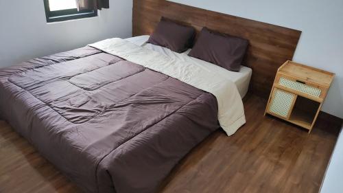 Ένα ή περισσότερα κρεβάτια σε δωμάτιο στο Mustika Dieng Homestay Fullhouse