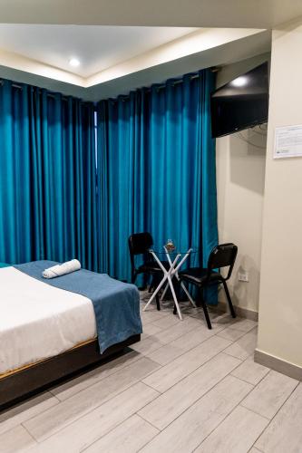 Postel nebo postele na pokoji v ubytování Hotel Konford Cañete