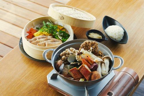 a table topped with a pot of food and rice at Fourtreat Hakone Sengokuhara in Hakone