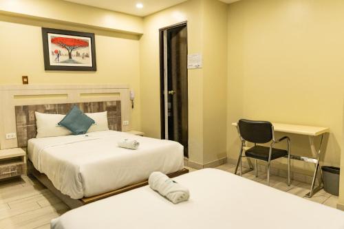 Postel nebo postele na pokoji v ubytování Hotel Konford Cañete