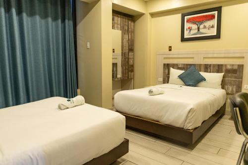 Postel nebo postele na pokoji v ubytování Hotel Konford Cañete