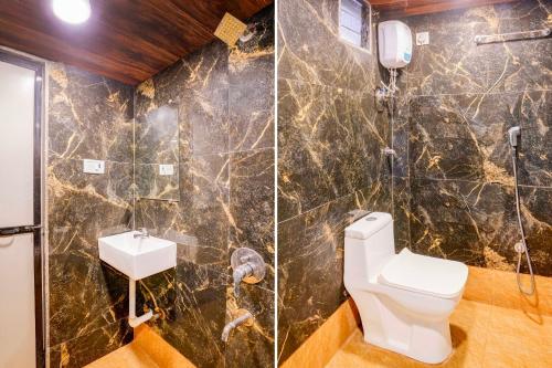 a bathroom with a toilet and a sink at Collection O Palava Dombivali in Mumbai