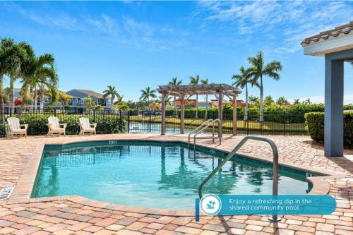 a swimming pool with a slide in a resort at 114 Mediterranean Way in Indian Harbour Beach